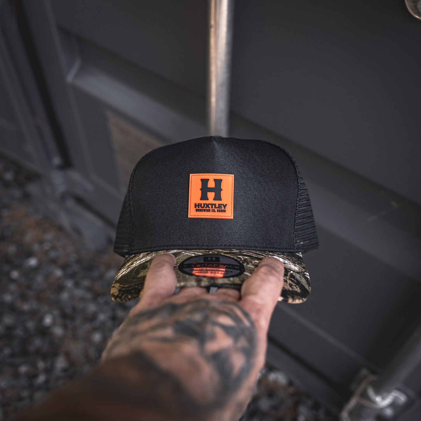 
                  
                    Casquette HS-73 Classique Noir/ "Hunter Camo"/ Orange Néon
                  
                