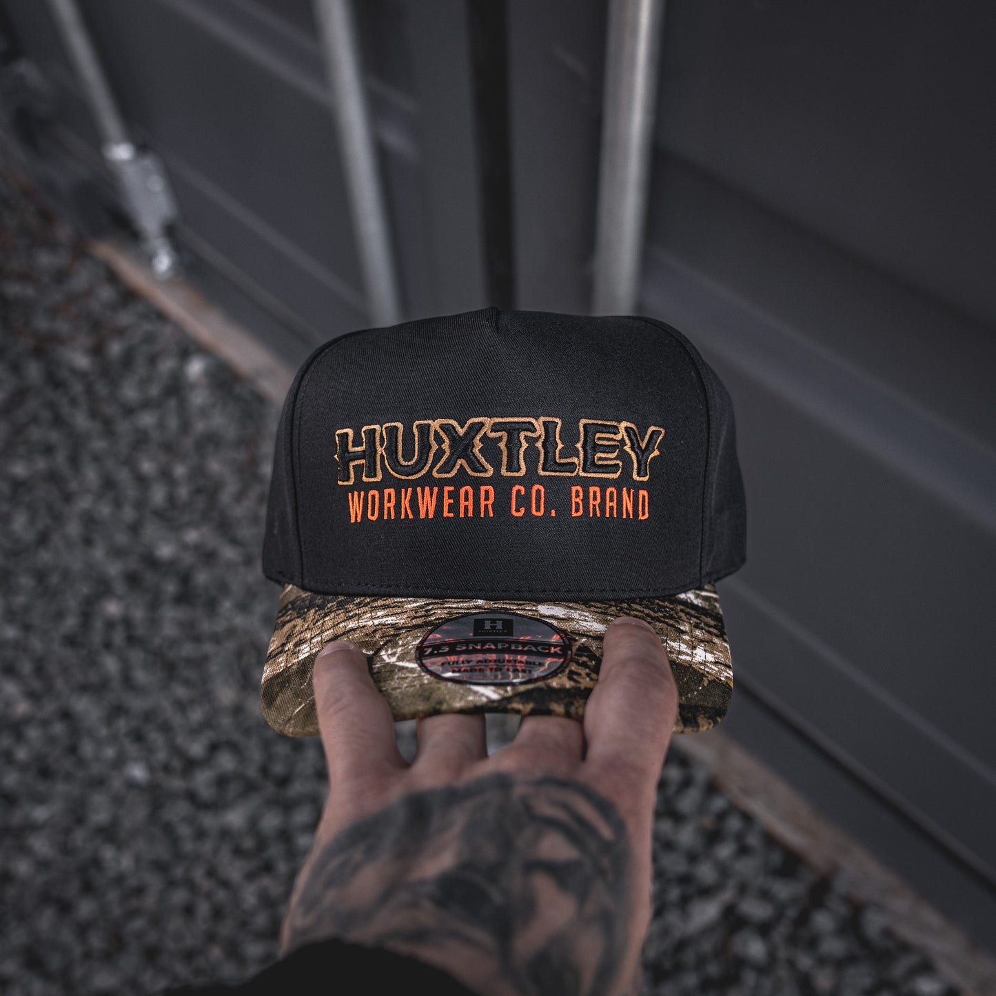 
                  
                    Casquette HS-73 "Workwear Co. Brand" Noir/ "Hunter Camo"/ Sable / Orange Néon
                  
                