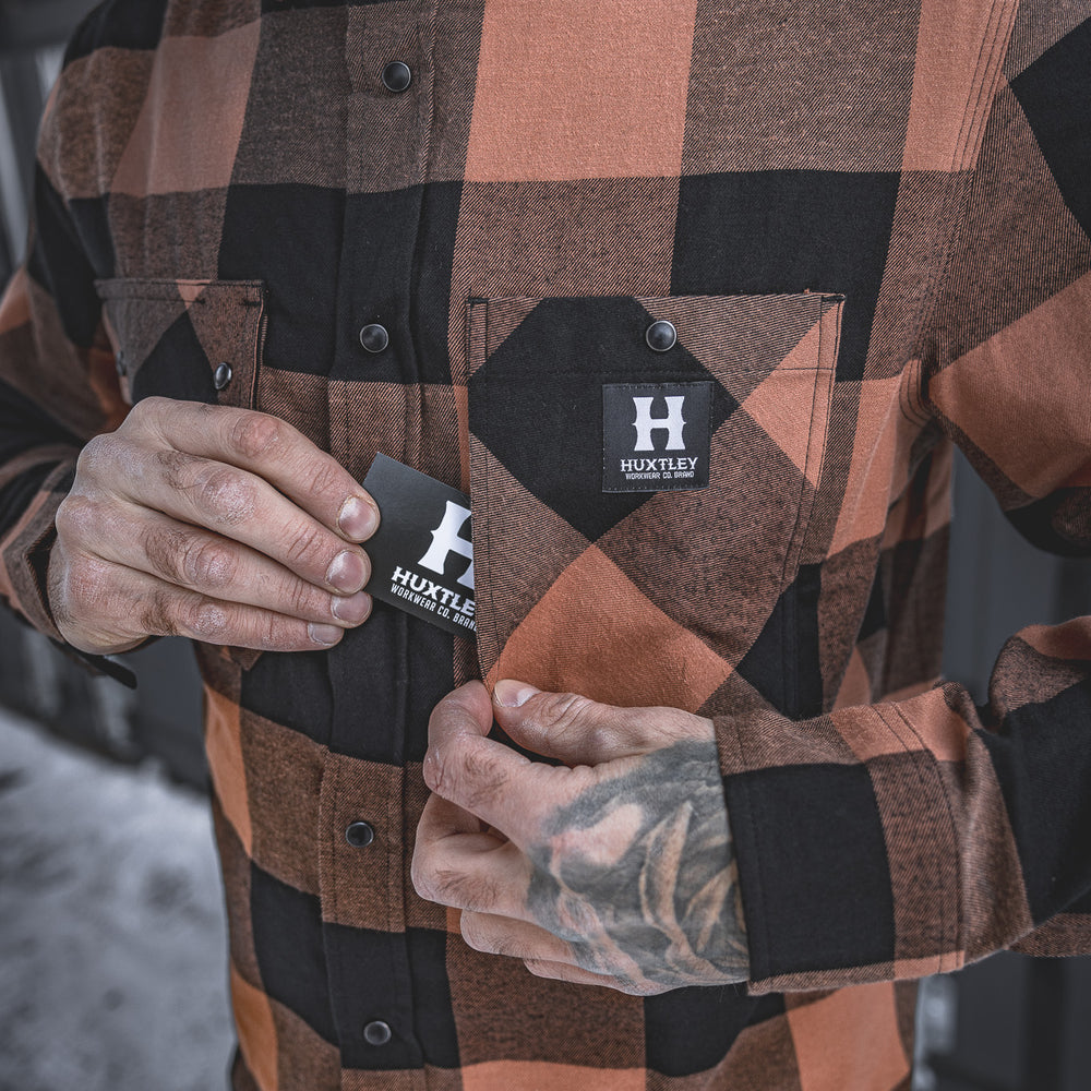 
                  
                    The Huxtley HD-57 Flex Flannel in Whiskey/Black features a hidden inner pocket behind the chest flap—ideal for stashing cards, keys, or small essentials while staying hands-free on the job.
                  
                