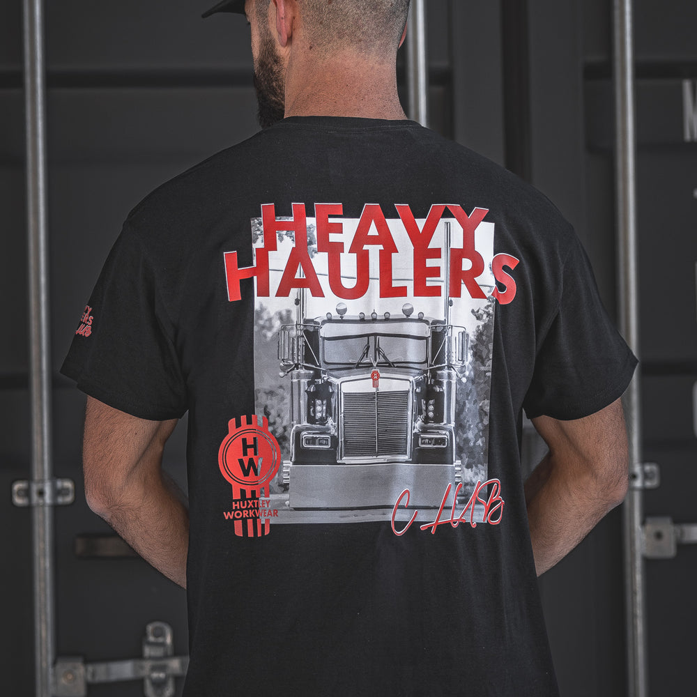
                  
                    Join the Heavy Haulers Club with this Huxtley Workwear t-shirt featuring a bold Kenworth truck print and signature red accents. Built for the big rig lifestyle, this tee brings diesel attitude and all-day comfort.
                  
                