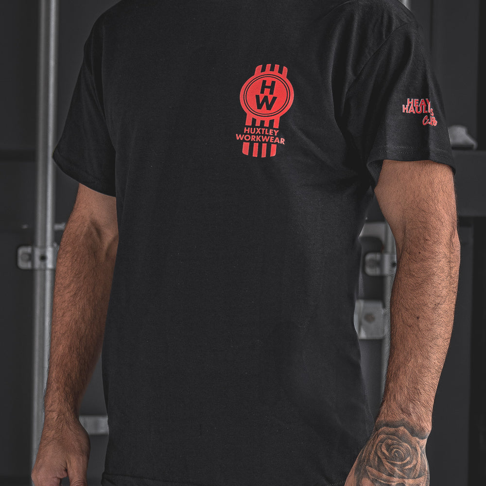 
                  
                    Rep the road in the Huxtley Heavy Haulers Club tee. This black trucker shirt features bold red graphics, a front HW logo hit, and a full-size rig on the back. Made for the diesel crew, built to haul hard
                  
                
