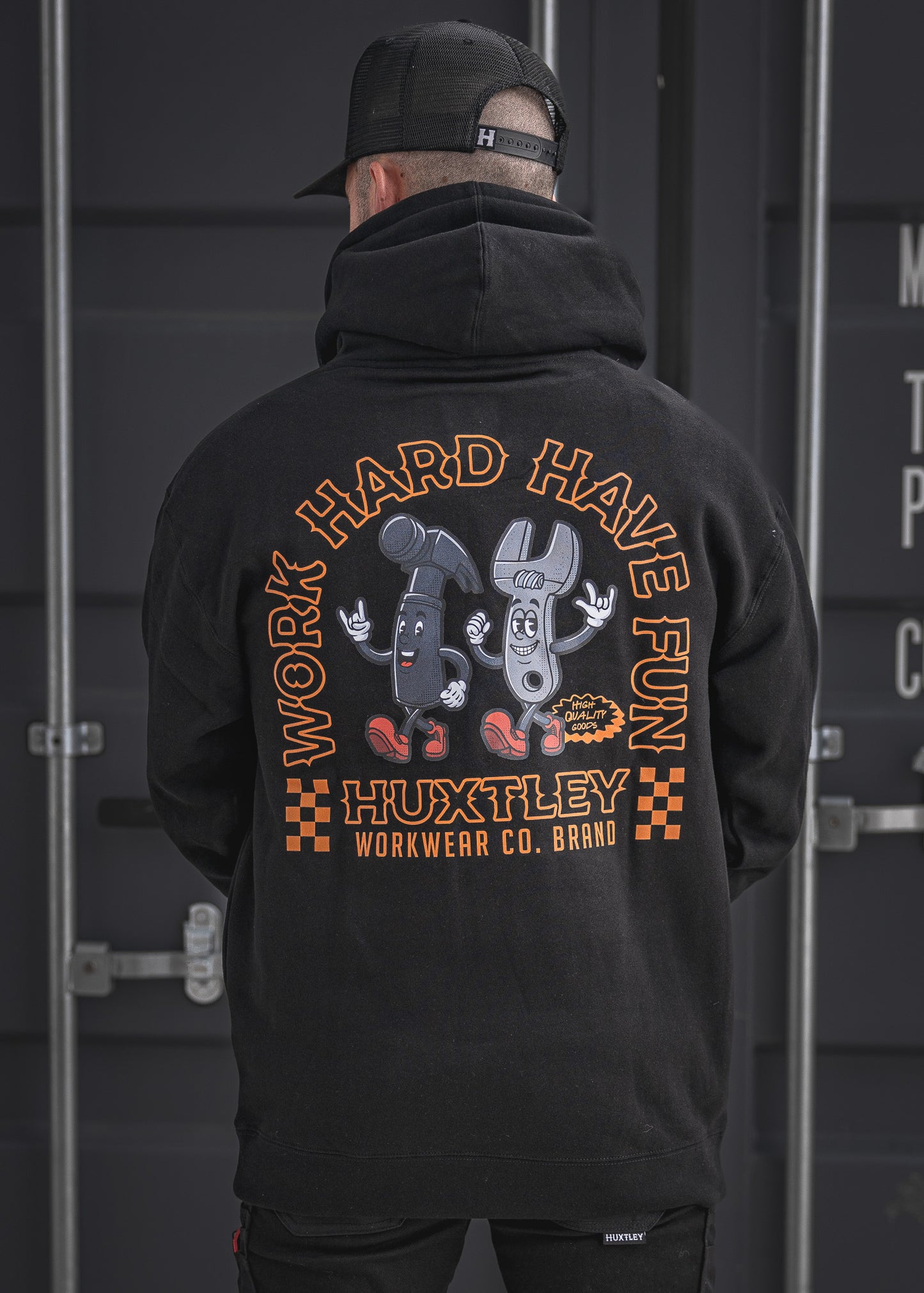 Grind hard, smile harder in the Huxtley Work Hard Have Fun Hoodie. This black hoodie features bold orange print and a fun cartoon hammer-and-wrench duo, built for jobsite jokers who don’t take life too seriously.