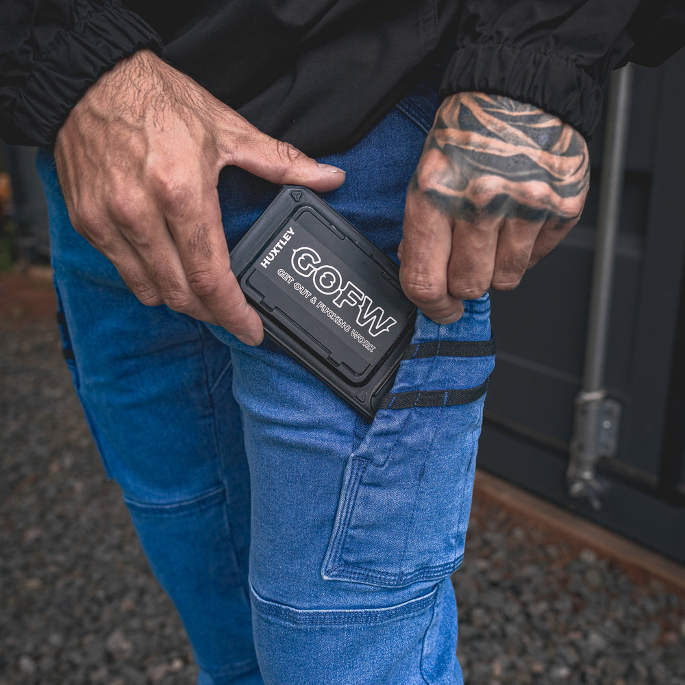 
                  
                    RX-1 Relaxed Work Jeans in Stonewashed Blue shown with a phone in the side pocket — fits your device or small tools with ease.
                  
                