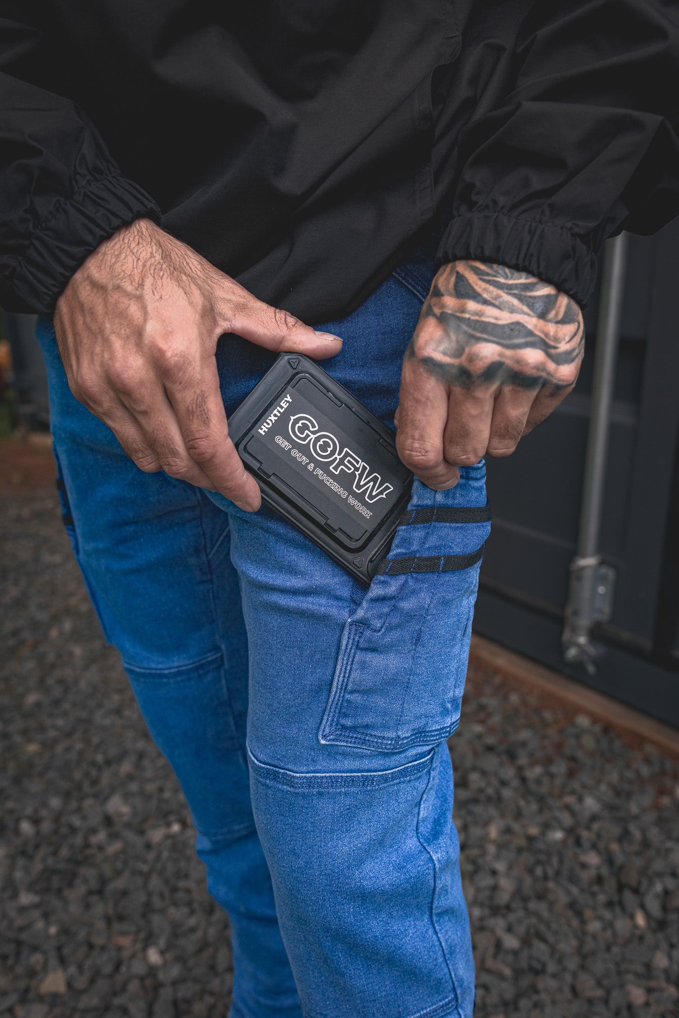 
                  
                    RX-1 Relaxed Work Jeans in Stonewashed Blue shown with a phone in the side pocket — fits your device or small tools with ease.
                  
                