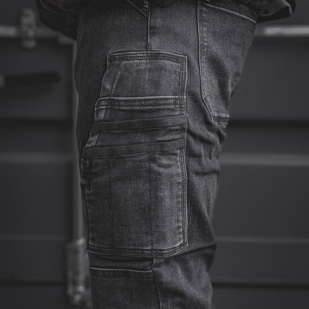 
                  
                    Zoomed-in look at the RX-1 Relaxed Work Jeans in Stonewashed Black, highlighting the rugged side utility pockets designed for tools, gear, or whatever the job throws at you.
                  
                