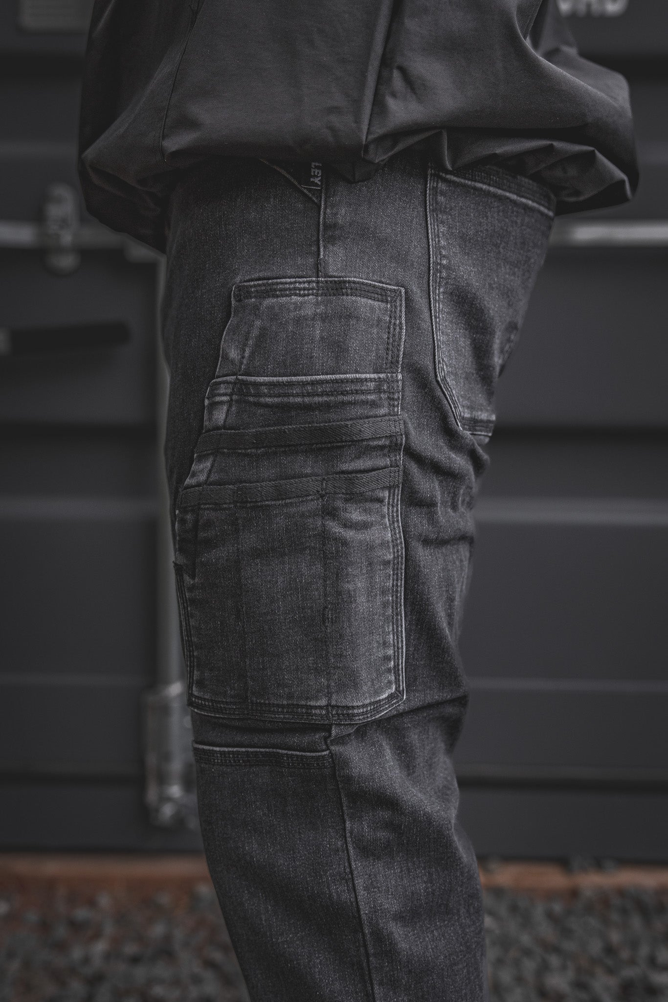 
                  
                    Zoomed-in look at the RX-1 Relaxed Work Jeans in Stonewashed Black, highlighting the rugged side utility pockets designed for tools, gear, or whatever the job throws at you.
                  
                