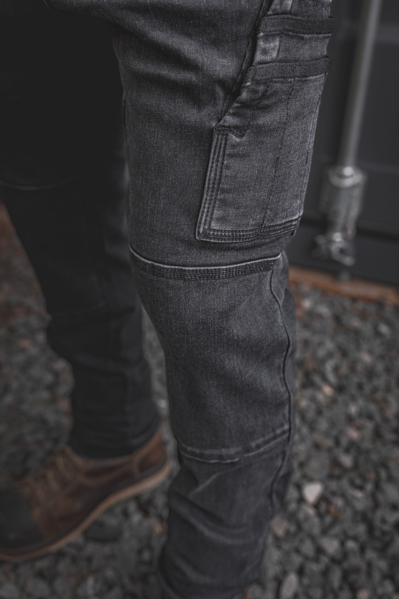 
                  
                    Close-up of the RX-1 Relaxed Work Jeans in Stonewashed Black, showcasing reinforced utility pocket and articulated knee panel built for the toughest workdays.
                  
                