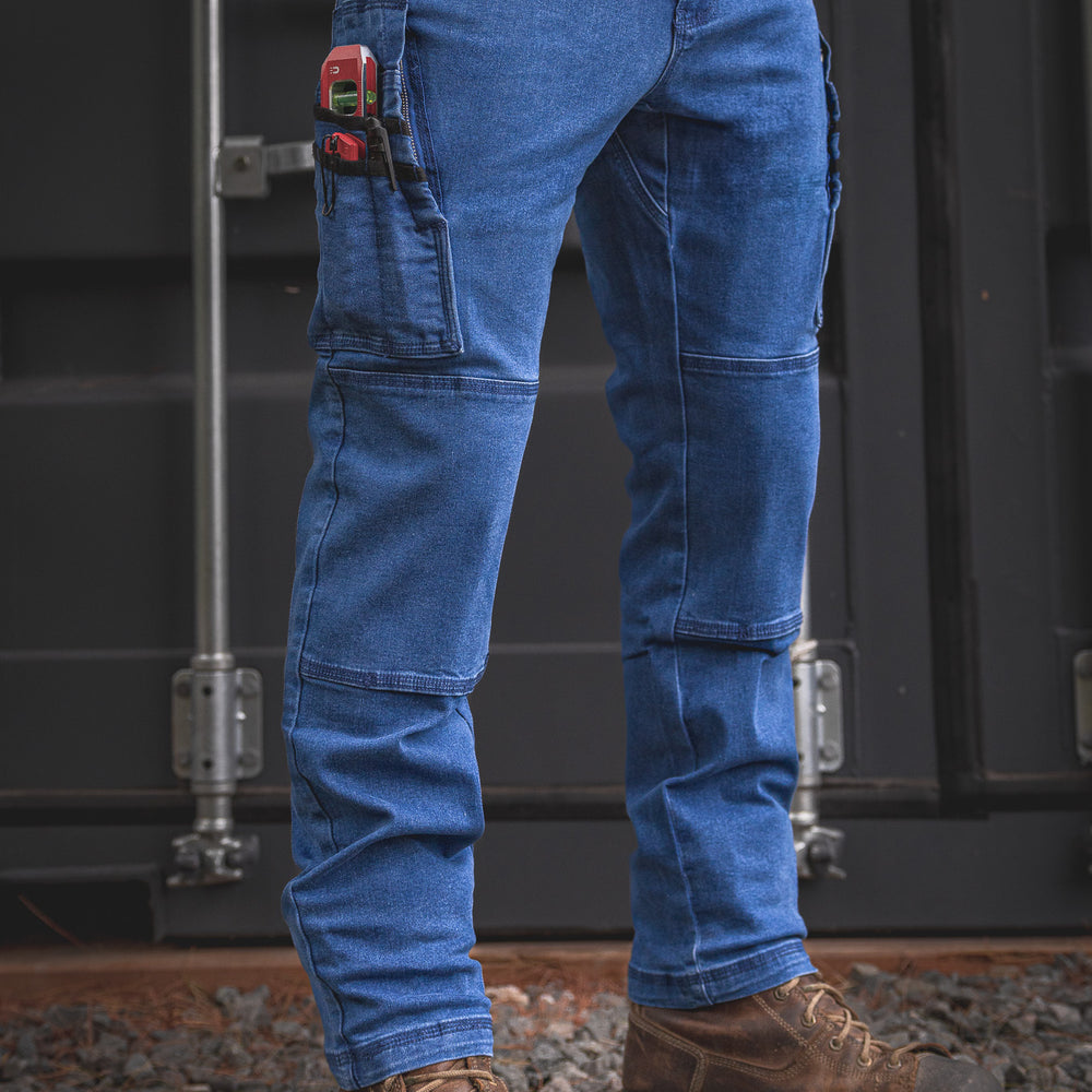 
                  
                    RX-1 Relaxed Work Jeans in Stonewashed Blue shown fully geared up—designed with reinforced tool loops and deep utility pockets for every tradesman’s daily loadout.
                  
                
