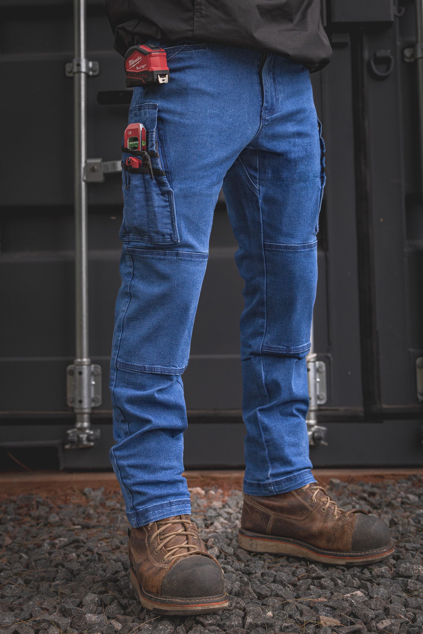 
                  
                    RX-1 Relaxed Work Jeans in Stonewashed Blue shown fully geared up—designed with reinforced tool loops and deep utility pockets for every tradesman’s daily loadout.
                  
                