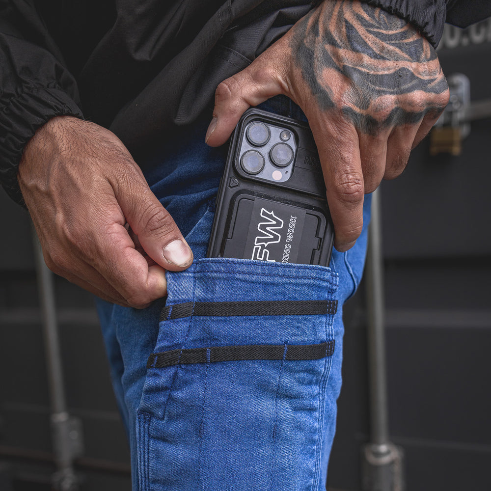 
                  
                    Close-up of the RX-1 Relaxed Work Jeans in Stonewashed Blue featuring a reinforced side pocket perfect for your phone or small tools on site.
                  
                