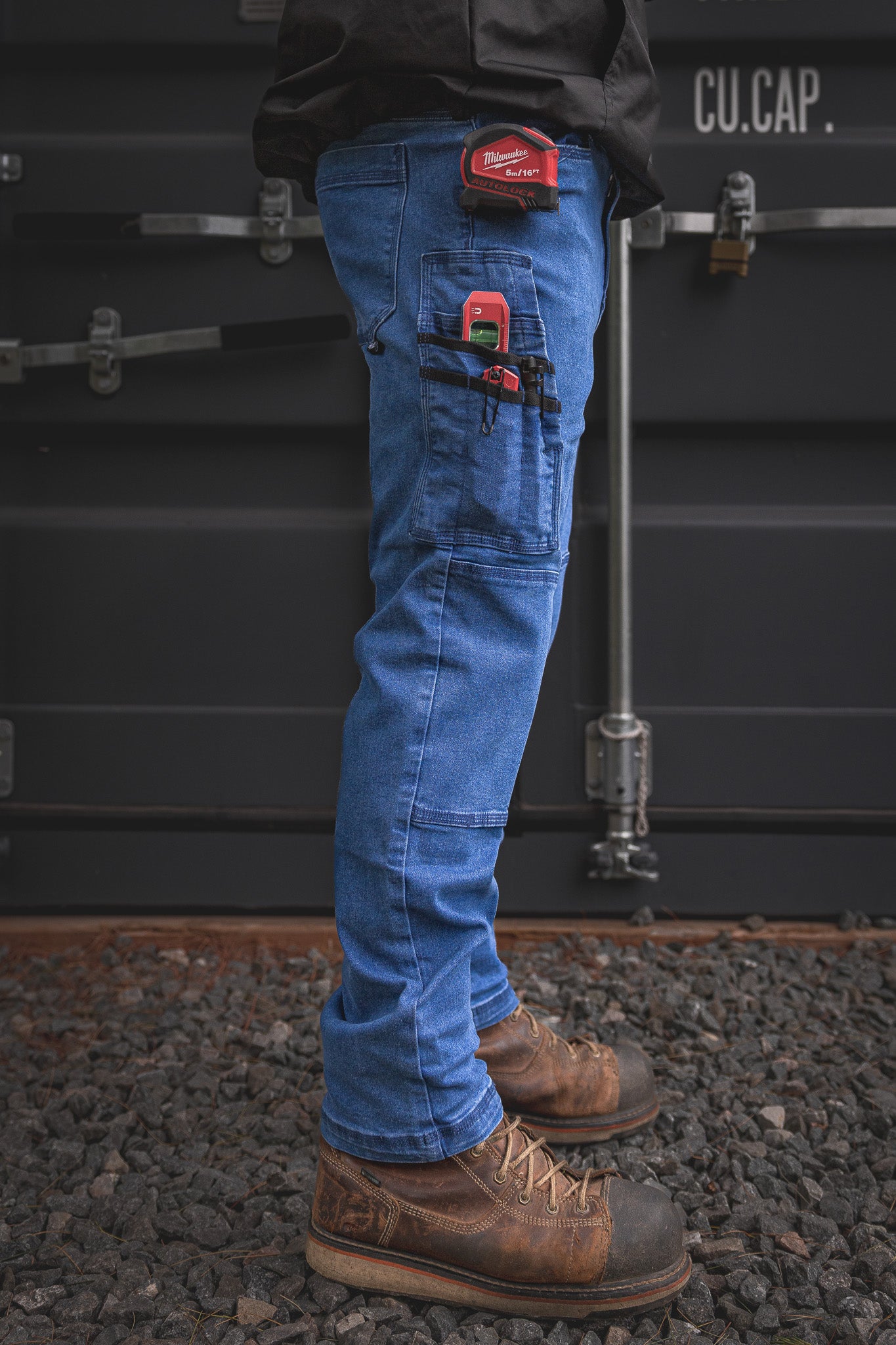 
                  
                    RX-1 Relaxed Work Jeans in Stonewashed Blue shown packed with gear—built with utility straps and secure pockets made to keep your tools locked in and close at hand.
                  
                