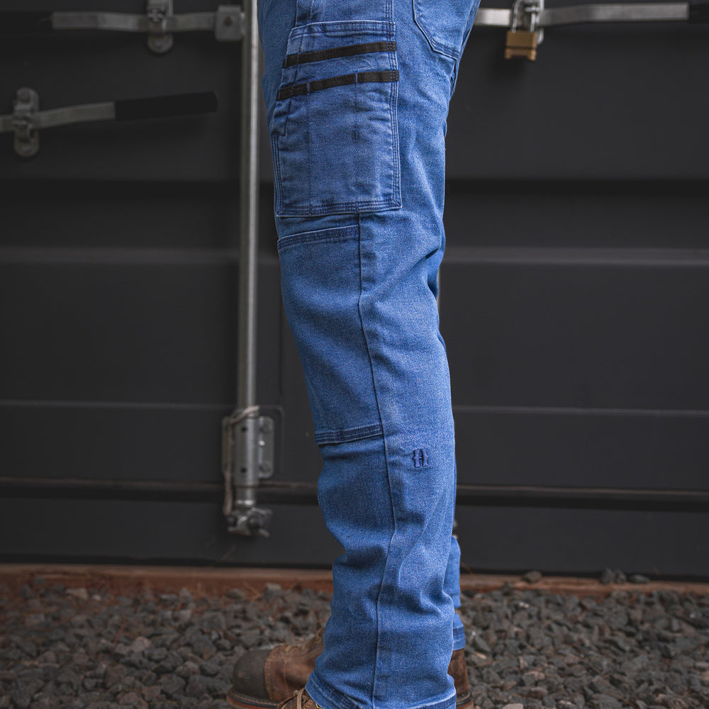 
                  
                    Detailed profile of the RX-1 Relaxed Work Jeans in Stonewashed Blue, built with functional side pockets and stretch denim for easy movement on tough jobs.
                  
                