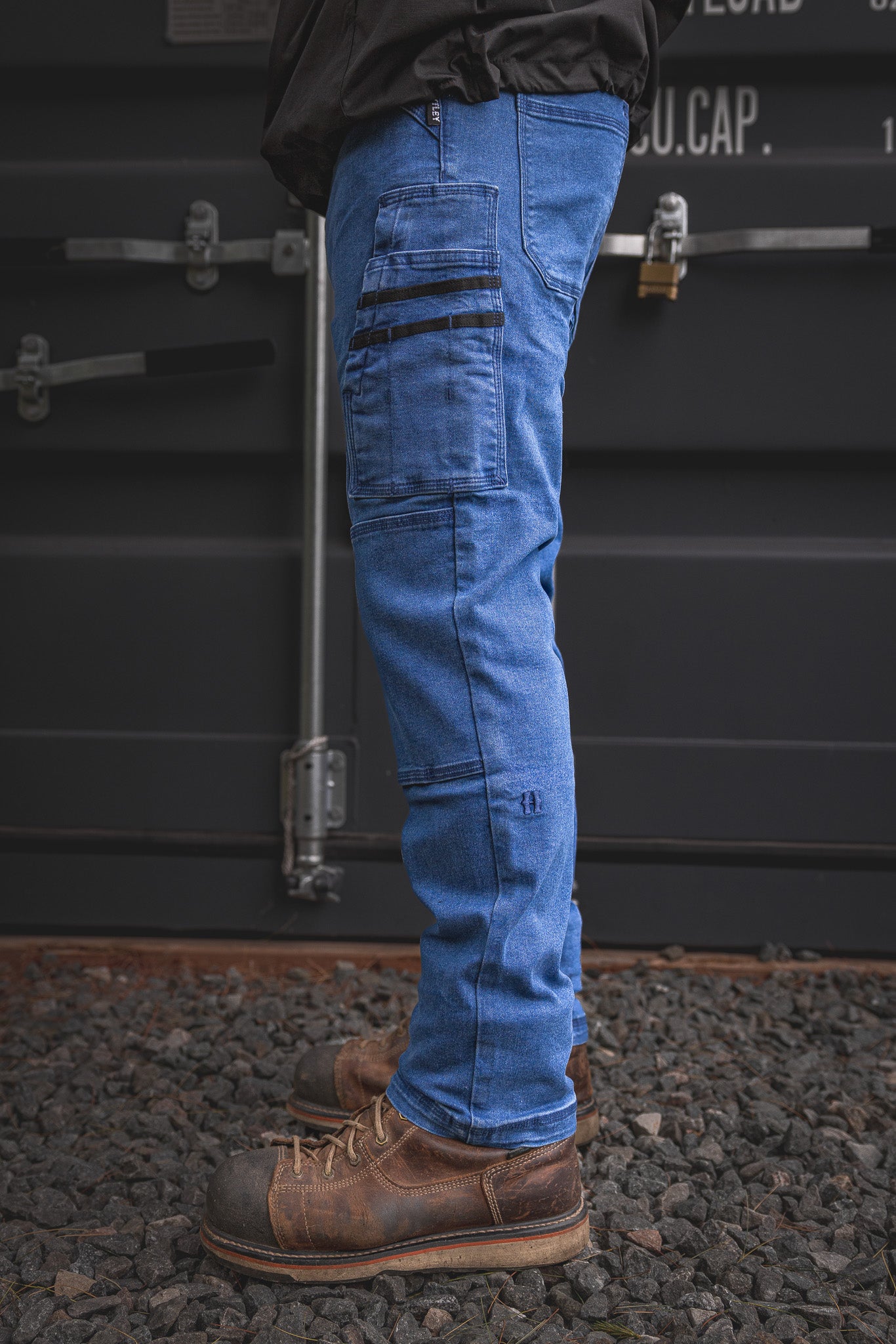 
                  
                    Detailed profile of the RX-1 Relaxed Work Jeans in Stonewashed Blue, built with functional side pockets and stretch denim for easy movement on tough jobs.
                  
                